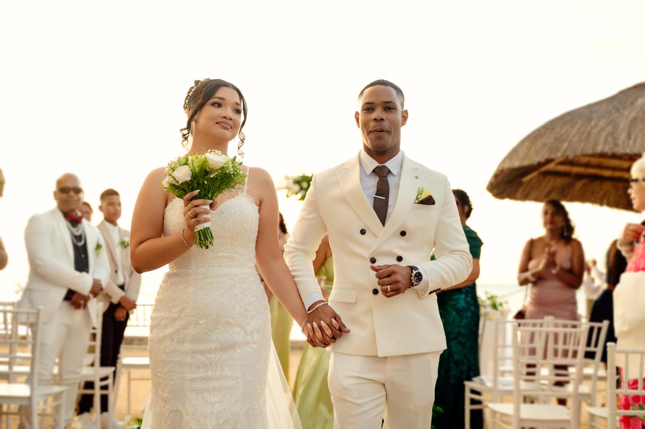 Beach ceremony aisle with white chairs